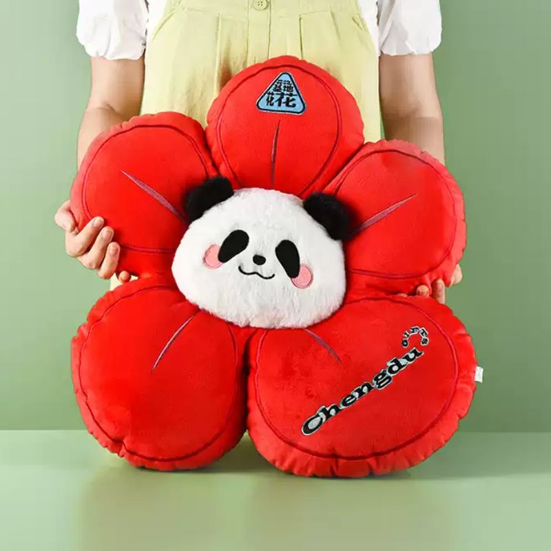 Adorable He Hua panda pillow placed on a cozy sofa as a decorative home accent.